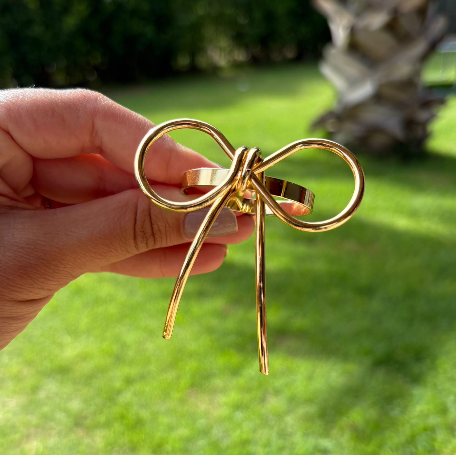 Porta-guardanapo laço dourado