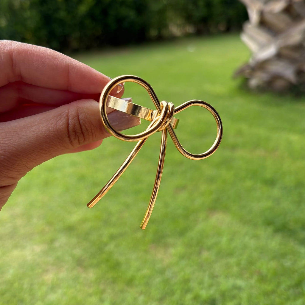 Porta-guardanapo laço dourado